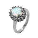 Кольцо из серебра с опалом и фианитами родированное