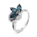 Кольцо из серебра с нат.топазом лондон блю и фианитами родированное