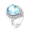 Кольцо из серебра с голубым топазом и фианитами родированное