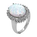 Кольцо из серебра с опалом и фианитами родированное