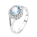 Кольцо из серебра с нат. голубым топазом и фианитами родированное