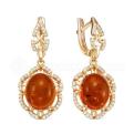 Серьги из золочёного серебра с янтарем и фианитами