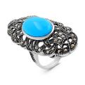 Кольцо из серебра с синт. бирюзой и марказитами родированное