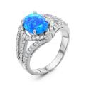 Кольцо из серебра с синим опалом и фианитами родированное