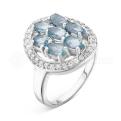 Кольцо из серебра с топазом и фианитами родированное