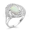 Кольцо из серебра с опалом и фианитами родированное