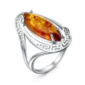 Кольцо из серебра с прессованным янтарём родированное