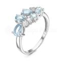 Кольцо из серебра с топазом sky и фианитами родированное