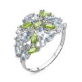 Кольцо из серебра с нат.хризолитом, нат.sky топазом и фианитами родированное