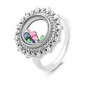 Кольцо из серебра с юв.стеклом и фианитами родированное