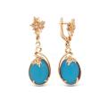 Серьги из золочёного серебра с синт. опалом цв. голубой