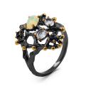 Кольцо из серебра с нат.опалом, топазом, сапфировым корундом и золочением родированное