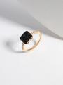 Кольцо из золочёного серебра с натуральной чёрной шпинель, фианитами и родированием