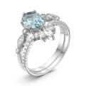 Кольцо двойное из серебра с пл. кварцем цв. Sky топаз и фианитами родированное