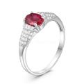 Кольцо из серебра с рубином и фианитами родированное