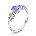 Кольцо из серебра с танзанитом и кубическим цирконием родированное
