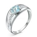 Кольцо из серебра с голубым топазом и фианитами родированное