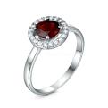 Кольцо из серебра с натуральным гранатом и фианитами родированное