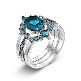 Кольцо тройное из серебра с пл. кварцем цв. лондон-топаз и фианитами родированное