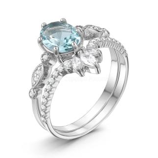 Кольцо двойное из серебра с пл. кварцем цв. Sky топаз и фианитами родированное