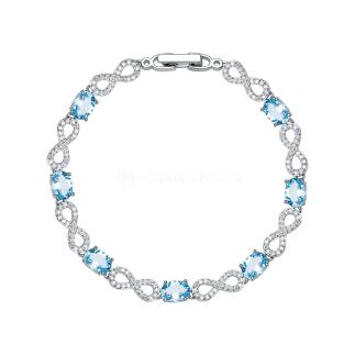 Браслет из серебра с голубым топазом и кубическим цирконием родированный